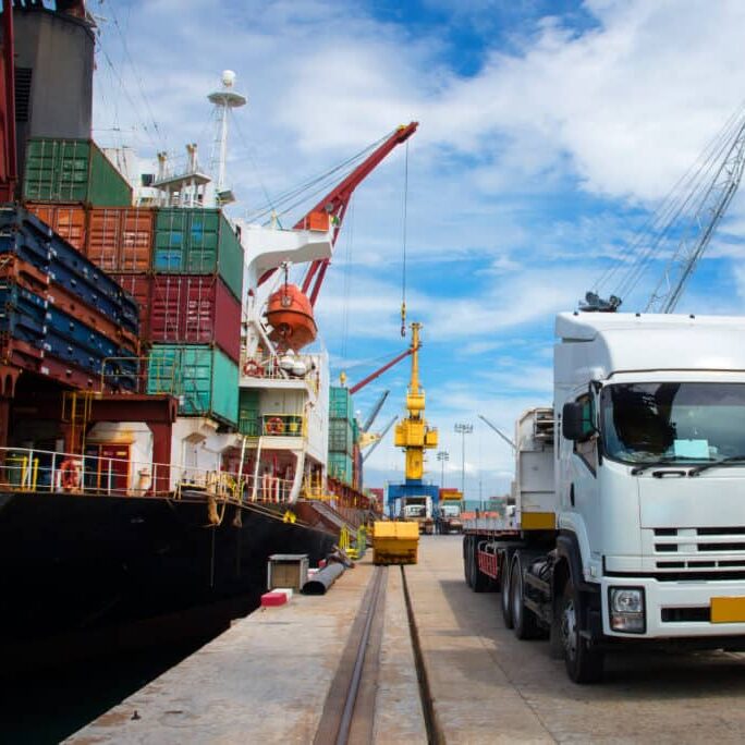 delivery and transit cargo units of container from yard to the ship vessel loading in port terminal by trucking of lorry, the logistics system services to global worldwide transportation CONCEPT